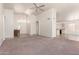 Spacious living room featuring high ceilings and neutral tile and carpet at 10845 W Manzanita Dr, Peoria, AZ 85345