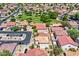 Extensive community shot with rows of houses and a green common area, showcasing neighborhood amenities at 1090 S Bogle Ct, Chandler, AZ 85286