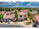 A high aerial shot of a two-story home featuring a red tile roof, desert landscaping, and a two-car garage at 1090 S Bogle Ct, Chandler, AZ 85286