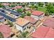 Wide angle shot of a red tile roofed home with a backyard patio, surrounded by other homes at 1090 S Bogle Ct, Chandler, AZ 85286
