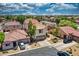 A high-angle aerial view of a single Gathering home in a neighborhood featuring mature landscaping at 1090 S Bogle Ct, Chandler, AZ 85286