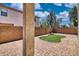 Landscaped backyard with brick pavers, artificial grass and privacy walls creating an outdoor living space at 1090 S Bogle Ct, Chandler, AZ 85286