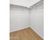 Empty closet with a hanging rod and hardwood-style flooring at 1090 S Bogle Ct, Chandler, AZ 85286