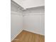 Empty closet with a hanging rod and hardwood-style flooring at 1090 S Bogle Ct, Chandler, AZ 85286