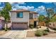 Two-story home featuring a neutral stucco exterior, terracotta roof, and a two-car garage at 1090 S Bogle Ct, Chandler, AZ 85286