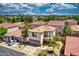 An elevated angle of a two-story home with red-tiled roof in a neighborhood setting at 1090 S Bogle Ct, Chandler, AZ 85286