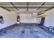 Spacious two car garage with an electric car charger, shelving, and water heater at 1090 S Bogle Ct, Chandler, AZ 85286