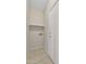 Functional laundry room with shelving and tile flooring at 1090 S Bogle Ct, Chandler, AZ 85286