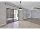 Living room with sliding door to patio, tile flooring, and abundant natural light at 1090 S Bogle Ct, Chandler, AZ 85286