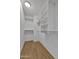 Walk-in closet with multiple shelves and hardwood-style flooring at 1090 S Bogle Ct, Chandler, AZ 85286