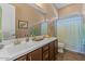 Bathroom featuring updated vanity with sink and large mirror at 10914 E Tarragon Ave, Mesa, AZ 85212