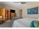 Comfortable bedroom features a sauna, ceiling fan, and neutral tones for a relaxing atmosphere at 10914 E Tarragon Ave, Mesa, AZ 85212