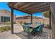 Charming covered patio with dining table and chairs, offering an inviting outdoor space at 10914 E Tarragon Ave, Mesa, AZ 85212