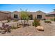 Charming front yard with desert landscaping and a walkway leading to the entrance of this inviting single-Gathering home at 10914 E Tarragon Ave, Mesa, AZ 85212