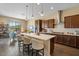 Modern kitchen features stainless steel appliances and a spacious island with seating at 10914 E Tarragon Ave, Mesa, AZ 85212