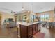 Open-concept floorplan includes a lovely living room adjacent to a modern kitchen and outdoor access at 10914 E Tarragon Ave, Mesa, AZ 85212