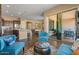 Cozy living area connects to the kitchen and patio, with comfortable seating for relaxing and entertaining at 10914 E Tarragon Ave, Mesa, AZ 85212