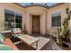 Charming front patio with comfortable seating area at 10914 E Tarragon Ave, Mesa, AZ 85212