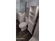 Clean bathroom featuring a stylish vanity, toilet, and storage unit at 11000 N 91St Ave # 84, Peoria, AZ 85345