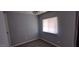 Neutral bedroom with a window providing natural light and a ceiling fan at 11000 N 91St Ave # 84, Peoria, AZ 85345