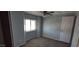Bedroom with a ceiling fan and bright natural light provides comfort at 11000 N 91St Ave # 84, Peoria, AZ 85345