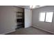 Functional bedroom with closet storage, shelving and a window at 11000 N 91St Ave # 84, Peoria, AZ 85345