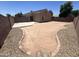 Wide angle of the backyard with a freshly poured concrete patio at 13004 W Saint Moritz Ln, El Mirage, AZ 85335