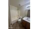 Bright bathroom features a tiled shower-tub, toilet and vanity with sink at 13004 W Saint Moritz Ln, El Mirage, AZ 85335