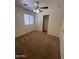 Bedroom features a window, carpet, ceiling fan, and closet at 13004 W Saint Moritz Ln, El Mirage, AZ 85335