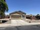 Charming single-Gathering home with two-car garage, desert landscaping, and paved driveway at 13004 W Saint Moritz Ln, El Mirage, AZ 85335