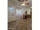 Kitchen area with view to living room, entry and hall. Tiled floor and breakfast bar at 13004 W Saint Moritz Ln, El Mirage, AZ 85335