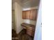 Small office area with desk and cabinets near a door at 13004 W Saint Moritz Ln, El Mirage, AZ 85335