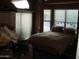 Bedroom featuring generous natural light from the large windows, creating a bright and inviting space at 1502 E Estrid Ave, Phoenix, AZ 85022