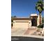 Inviting single-Gathering home boasts a well-manicured lawn, desert landscaping, and a two-car garage at 1502 E Estrid Ave, Phoenix, AZ 85022