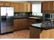 Bright, updated kitchen with stainless steel appliances, modern cabinets, and granite countertops at 1502 E Estrid Ave, Phoenix, AZ 85022