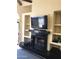 Modern living room with a sleek fireplace, built-in shelving, and sliding glass door at 1502 E Estrid Ave, Phoenix, AZ 85022