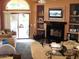 Cozy living room with stylish furniture, a modern fireplace, and a sliding glass door at 1502 E Estrid Ave, Phoenix, AZ 85022