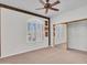 Bedroom featuring neutral carpet, window with shutters, and closet with sliding doors at 15377 W Catalina Ct, Goodyear, AZ 85395