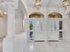 Bright entryway featuring decorative doors, tiled floors, and architectural columns at 15377 W Catalina Ct, Goodyear, AZ 85395