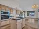 Open kitchen featuring a modern oven and views into the dining and living rooms at 15377 W Catalina Ct, Goodyear, AZ 85395