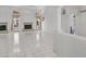 Spacious living room featuring tiled floors, a fireplace, and tall ceilings at 15377 W Catalina Ct, Goodyear, AZ 85395
