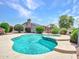 Beautiful private pool with spa, surrounded by mature landscaping for a serene outdoor experience at 15377 W Catalina Ct, Goodyear, AZ 85395