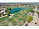 Golf course community view showcasing a lush green course with a lake at 16250 S 13Th St, Phoenix, AZ 85048