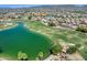 Aerial view of golf course community with a scenic lake and green landscaping at 16250 S 13Th St, Phoenix, AZ 85048