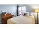 Bedroom with blue walls featuring a desk and wicker drawers at 16250 S 13Th St, Phoenix, AZ 85048