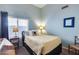 Relaxing bedroom with soft blue walls, and a large window for natural light at 16250 S 13Th St, Phoenix, AZ 85048