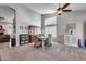 Open dining area featuring high ceilings, a ceiling fan, and large windows at 16250 S 13Th St, Phoenix, AZ 85048