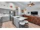 Modern kitchen seamlessly connected to the living room, featuring an island with seating at 16250 S 13Th St, Phoenix, AZ 85048