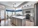 Spacious kitchen with stainless steel appliances, a central island, and tile floors at 16250 S 13Th St, Phoenix, AZ 85048