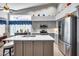 Bright kitchen featuring a central island, stainless steel appliances, and tile flooring at 16250 S 13Th St, Phoenix, AZ 85048